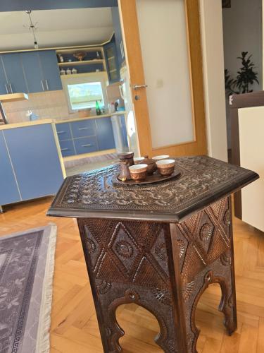 a table in a kitchen with two bowls on it at Villa Amir in Sarajevo