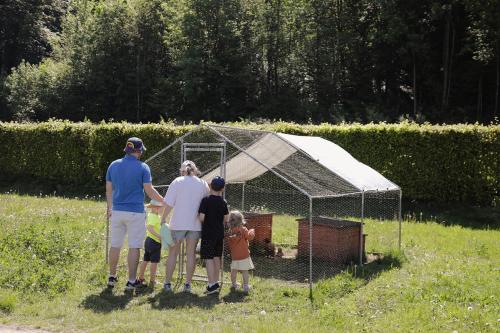 a group of people standing in front of a tent at Camping Le Florenville in Florenville