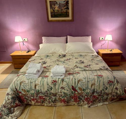 Postel nebo postele na pokoji v ubytování Casa vacanze Giuliani via Rasiglia