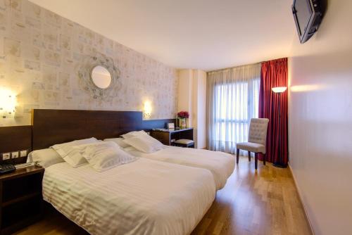 Ένα ή περισσότερα κρεβάτια σε δωμάτιο στο Hotel Castro Real
