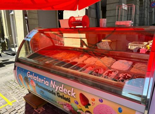 a food cart sitting on the side of a street at Nydeck in Bern