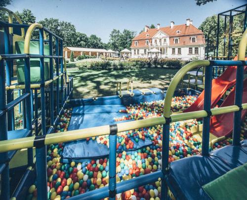 a water play area with a bunch of balls at Sventes Muiža in Svente