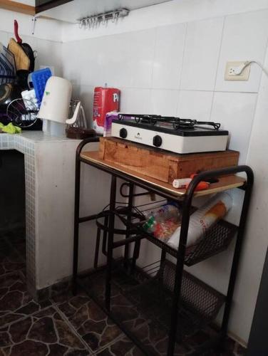 a kitchen with a stove on top of a table at Casa Valle de Sur in Durango