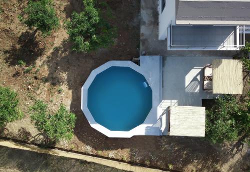an overhead view of a blue swimming pool at Terra Nova Luxury Villa in Mystras