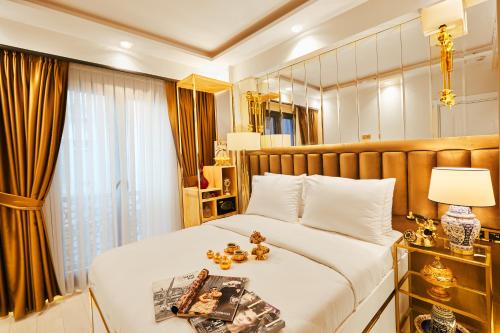 Un ou plusieurs lits dans un hébergement de l'établissement Mitspark Hotel