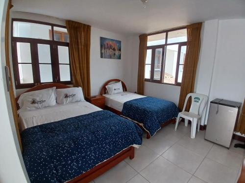 Säng eller sängar i ett rum på Hotel Garuda Pimentel