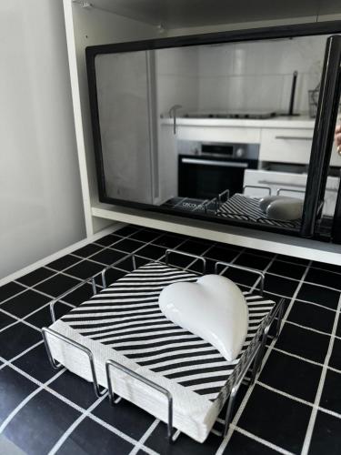 a white heart shaped object sitting on top of a kitchen floor at Alcarria , Casa del Agua in Albalate de Zorita