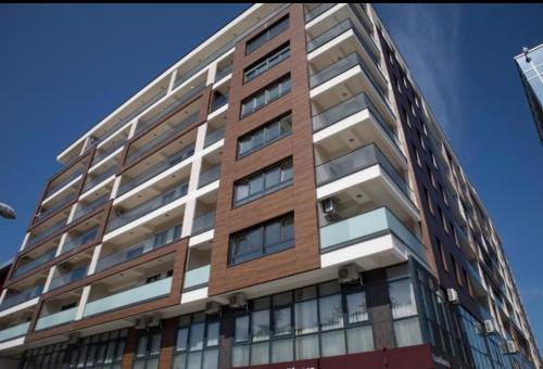 a tall building with windows on the side of it at R-RESIDENCY Tower in Banja Luka