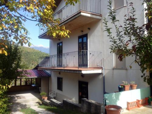 a large white building with a balcony on it at Appartamenti Vista Gransasso in LʼAquila