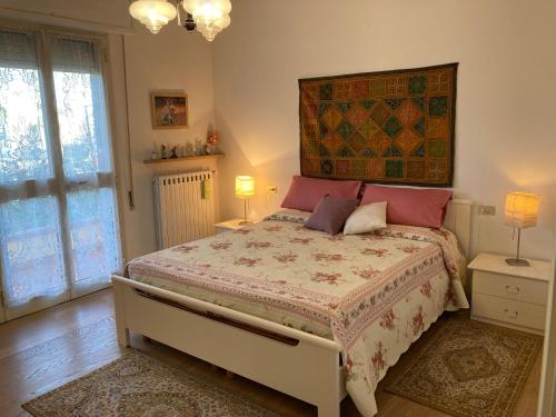 Katil atau katil-katil dalam bilik di Casa spaziosa e comoda vicino al centro