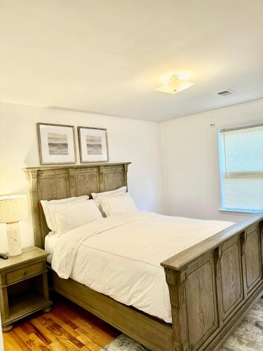 a bedroom with a large bed and a window at Stylish Evergreen Apartment By Newark Airport in Newark