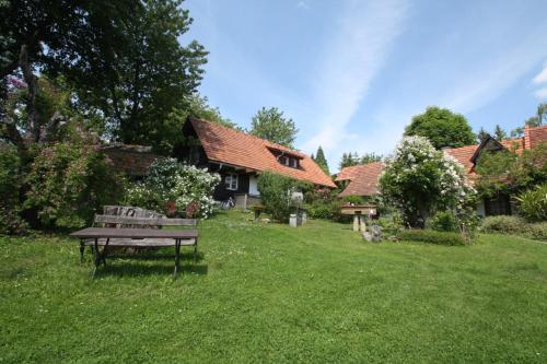 a park bench in the yard of a house at Altes Gehöft am Lormanberg in Kirchberg an der Raab