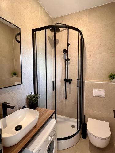 a bathroom with a shower and a toilet and a sink at New central studio - La Mer in Šibenik
