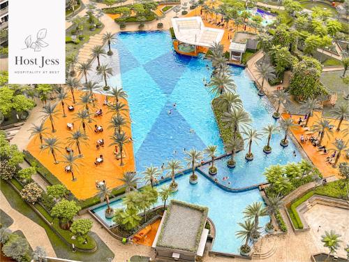 an overhead view of a pool at a resort at Gold Coast PIK Apartments by Host Jess in Jakarta