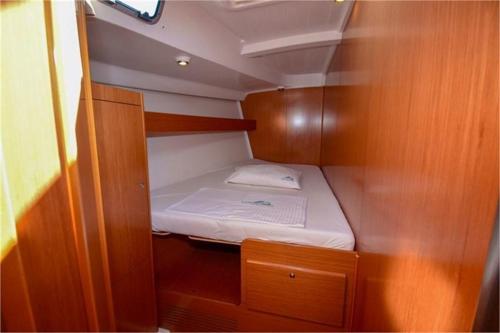 a small bed in the back of a boat at Maria Vittoria One night boat sail in Calasetta
