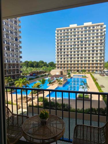 a balcony with a view of a hotel and a pool at MaryneL Suites in Suba