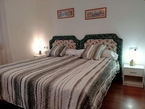 Postelja oz. postelje v sobi nastanitve Alojamientos Zabala en Anguiano