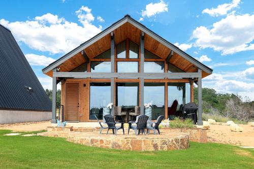 a pavilion with a table and chairs in a yard at Private, Waterfront Escape in New Braunfels