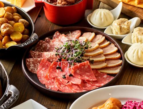 a table topped with a tray of different types of food at Hyatt Regency Tokyo Bay in Urayasu