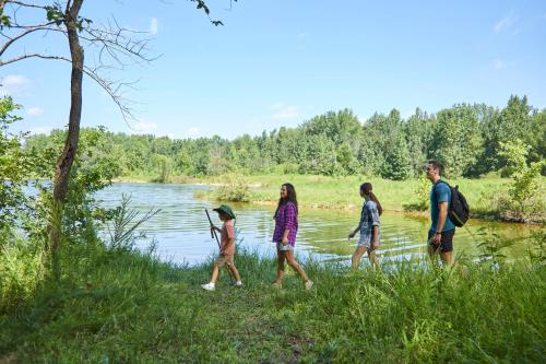 a group of people walking by a river at Barren River Lake State Resort Park in Lucas