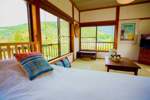 Postel nebo postele na pokoji v ubytování 一棟貸し宿 Kanata Riverview House