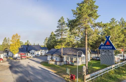 a street in a small town with a kalamaja sign at Levilehto Apartments in Levi