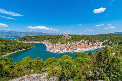 an aerial view of a town on a lake at Ibeach By Rok Apartment in Novigrad Dalmatia