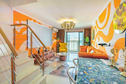 a living room with an orange and yellow wall at SKYINN Aparment 橙堡整套复式公寓 in Shenzhen