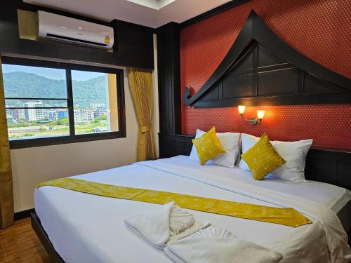 Cama o camas de una habitación en Nanai 2 Residence Patong Phuket