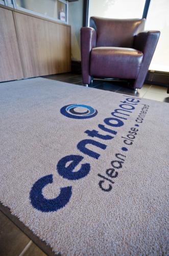 an office rug with the words stress out on it at Centro Motel in Calgary
