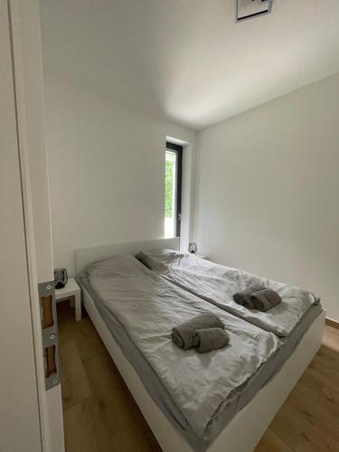 Postel nebo postele na pokoji v ubytování Kolokán Apartmanhàz
