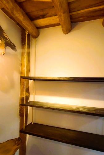 a set of shelves on a wall in a room at Cabañas Barikoke-Fiji in Moñitos