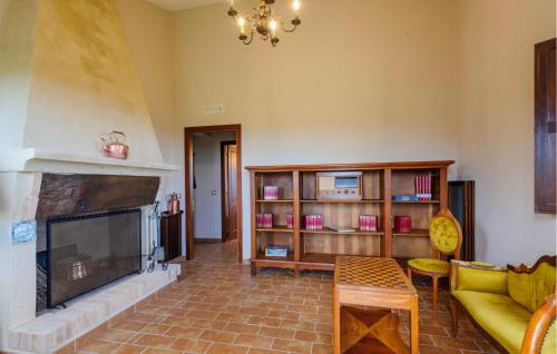 a living room with a fireplace and a couch at Casa La Tana Della Lepre in Cingoli
