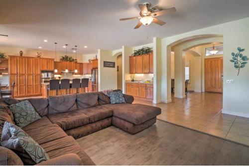 a living room with a brown couch and a kitchen at Estrella Magical Home! in Liberty