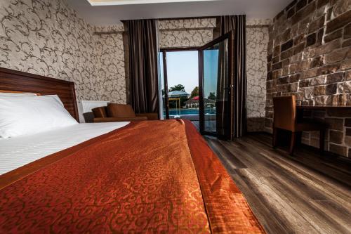 a hotel room with a bed and a fireplace at My Green Boutique Hotel in Sapanca
