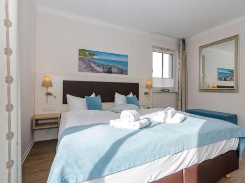 En eller flere senge i et værelse på Beach holiday Comfortable holiday residence