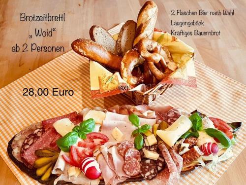 two pizzas and a box of pretzels and bread at in the country house at the national park in Lindberg