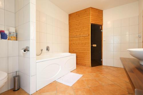 a bathroom with a white sink and a toilet at Chalupa s privátní saunou in Dolní Morava