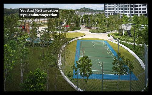 an overhead view of a tennis court in a city at Luge Gardens You and Me Staycation Gaia Residences in Rawang