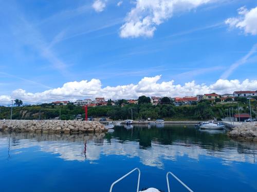 a view of a harbor with boats in the water at Studio Apartman Antonia in Rtina