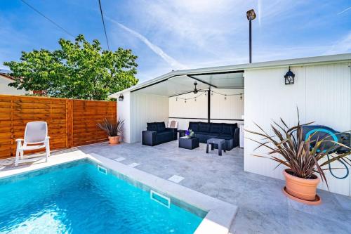 a swimming pool in the backyard of a house at House with private pool 150 m from sea! in Fažana