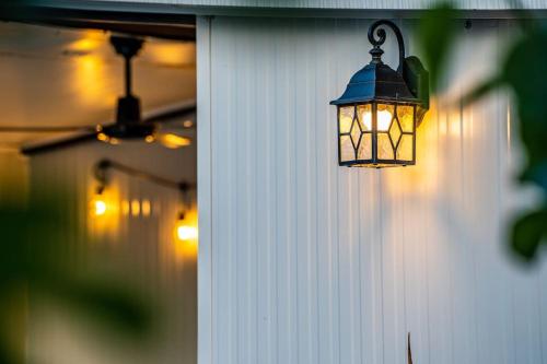 a lantern hanging on the side of a house at House with private pool 150 m from sea! in Fažana