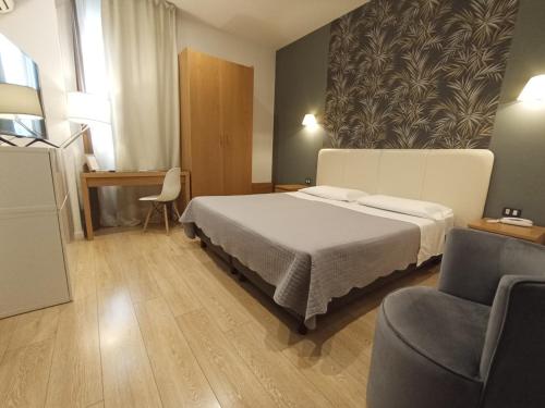 Ένα ή περισσότερα κρεβάτια σε δωμάτιο στο Relais Peucetia