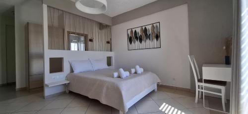 Ένα ή περισσότερα κρεβάτια σε δωμάτιο στο Pelagia Beach Studios