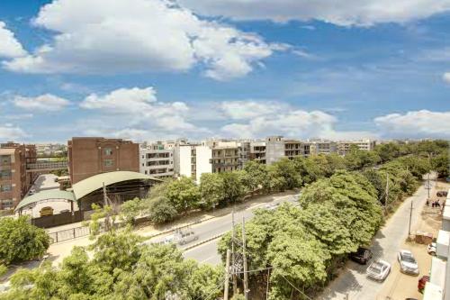 a view of a city with buildings and a street at Hotel Grand Manor in Gurgaon