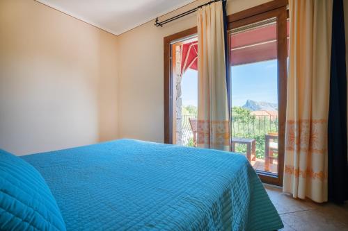 Una cama o camas en una habitación de Hotel Lu Pitrali