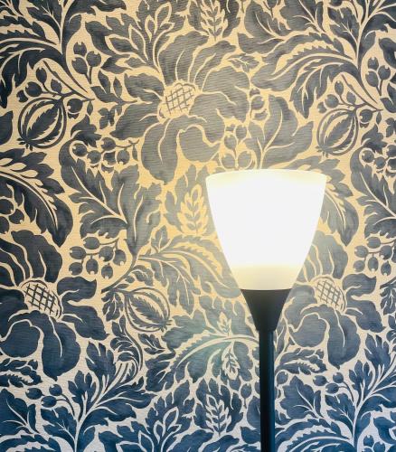 a wall with a blue and white wallpaper and a glass at Kyoto Sanjo Ohashi in Kyoto