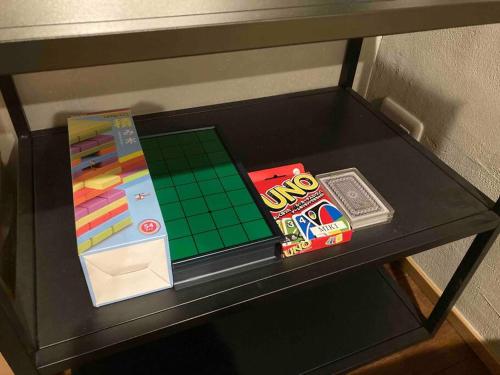 a table with a board game and other items on it at Miki in Osaka