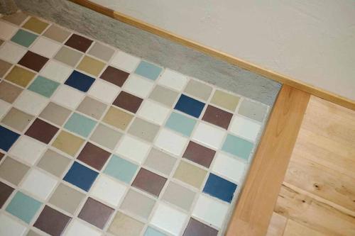 a room with a floor with colorful tiles at Miki in Osaka