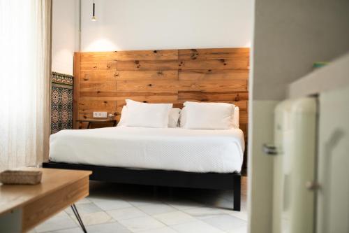 Postel nebo postele na pokoji v ubytování Apartahotel Siglo XIX